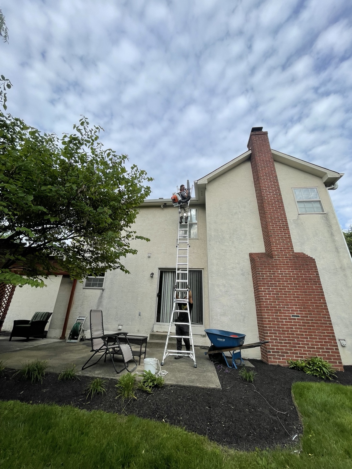 Gutter cleaning crew working at a Columbus home