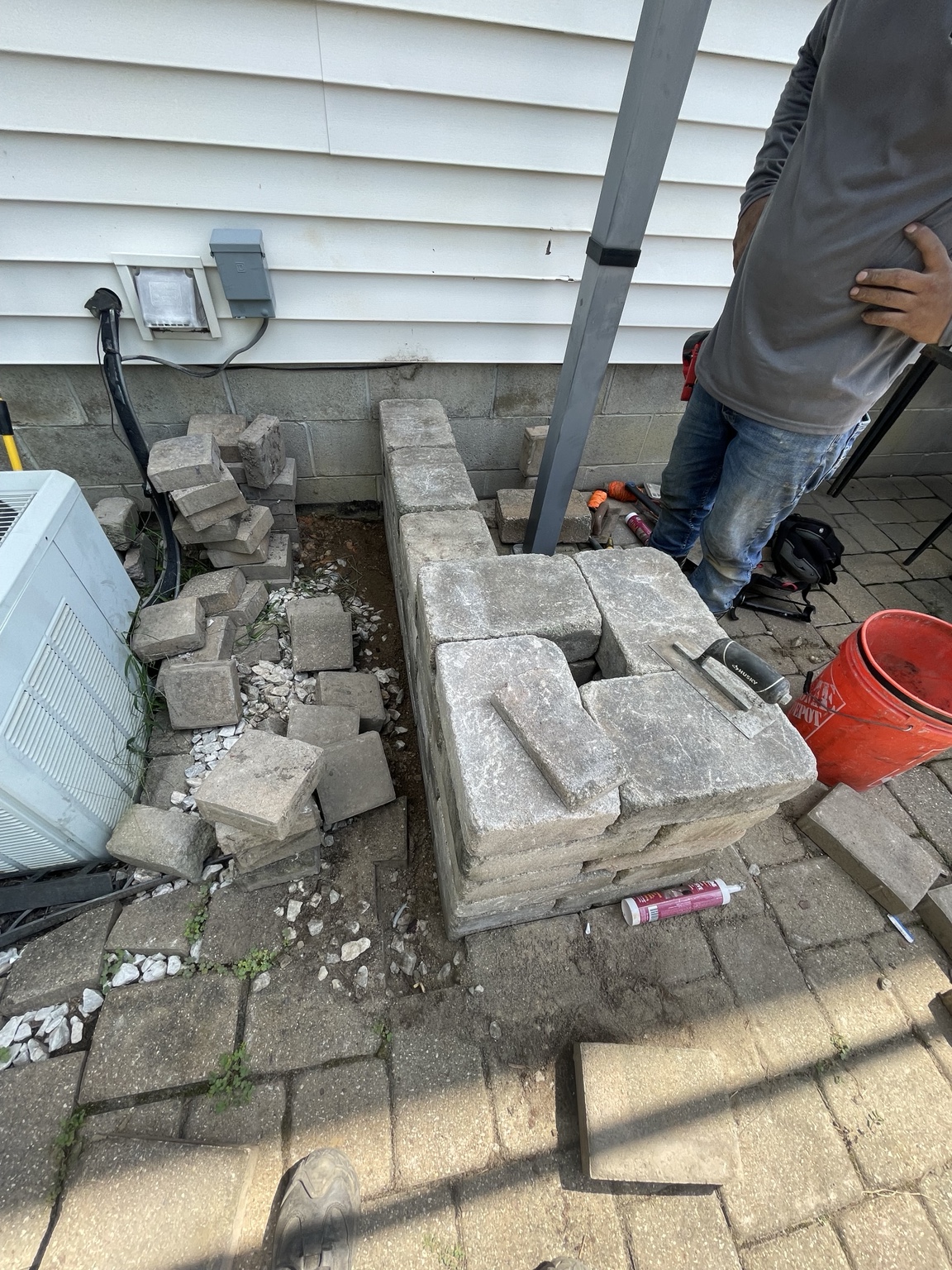 Retaining wall blocks being reset