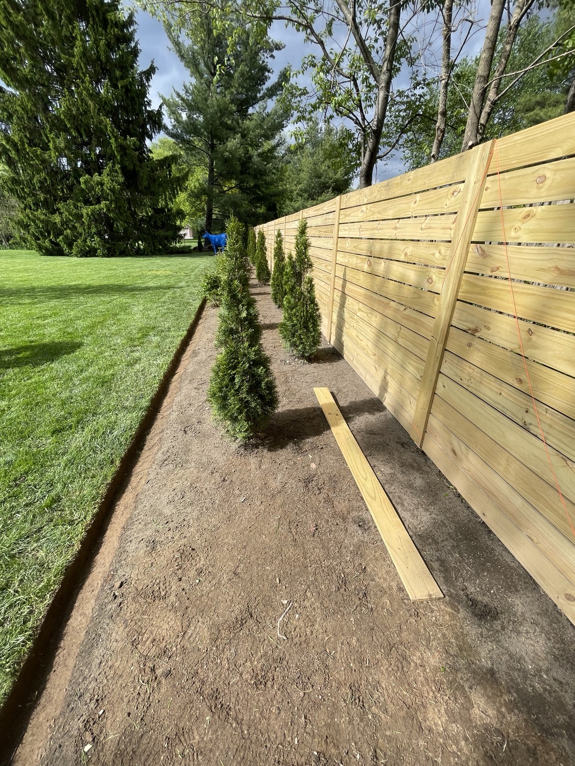 Completed horizontal wood fence section